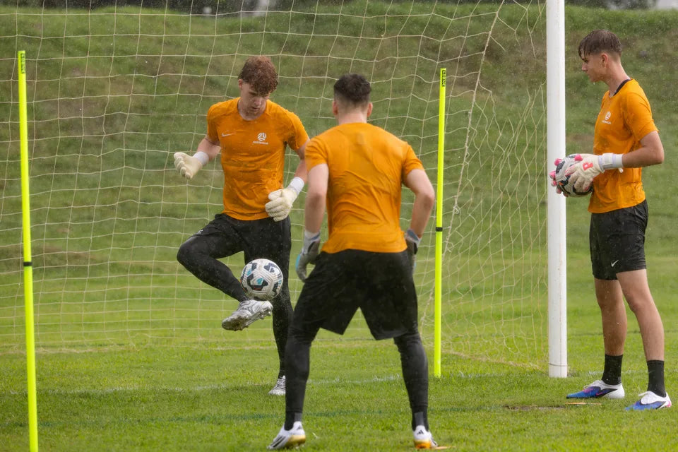 Goalkeepers putting in the work on the training pitch
